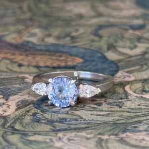 Kyanós - PLT 1.98ct Ceylon Round Sapphire Three Stone Ring with .40ct TDW D-F VS Pear Cut Diamonds