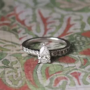 Bud - PLT .57ct F-G SI Pear Cut Diamond Multi Stone Ring with .25ct TDW Diamond Set Band & Undersetting Size L