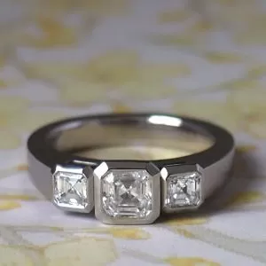 Protea - PLT .533ct F VS2 Asscher Diamond Three Stone Ring with .40ct G Si2 Rub Set with Open 'V' Size M