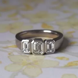Ikebana - 18WG .501ct D VVS2 & .644ct TDW D VVS Emerald Cut Three Stone Ring Size M