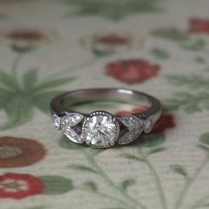 Sweet Pea - PLT .62ct F VS2 Brilliant Diamond with .14ct TDW Side Diamonds Multi Stone Ring Size M