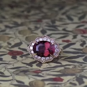 Medici - 9YG 7.19ct Red Oval Zircon Cluster Ring with  .51ct TDW D-F VS/Si Size O 1/2