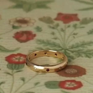 Carmine - 9RG 3.5mm Rounded Alternating Gyspy Set Band with .07ct TDW Diamonds and .085ct Rubies Size M