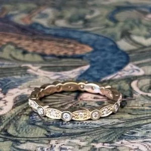 Marquette - 9YG .34ct TDW Round Diamonds in Marquise & Round Pattern Band with Milgrain Detail