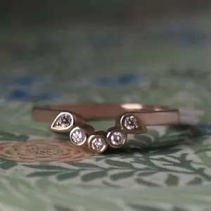 Nadine - 9RG .20ct TDW Round and Pear Grain Set Fitted Band Size N