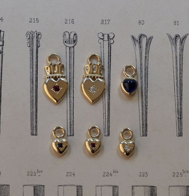 Win their heart with these beautiful charms from our new collection Talisman…representing love, charity and compassion or with a crown atop the ruler of your heart. 

Left to right - top to bottom:
Sacred in 9ct yellow gold set with ruby $445
Sacred in 9ct yellow gold set with diamond $545
Sweetie set with sapphire cabochon $510
Sweetie 9ct yellow gold set with sapphire $265
Sweetie 9ct yellow gold set with ruby $265
Sweetie 9ct yellow gold set with diamond $295

#talismancollection #sacredheart #heartcharms #filigreefinejewels